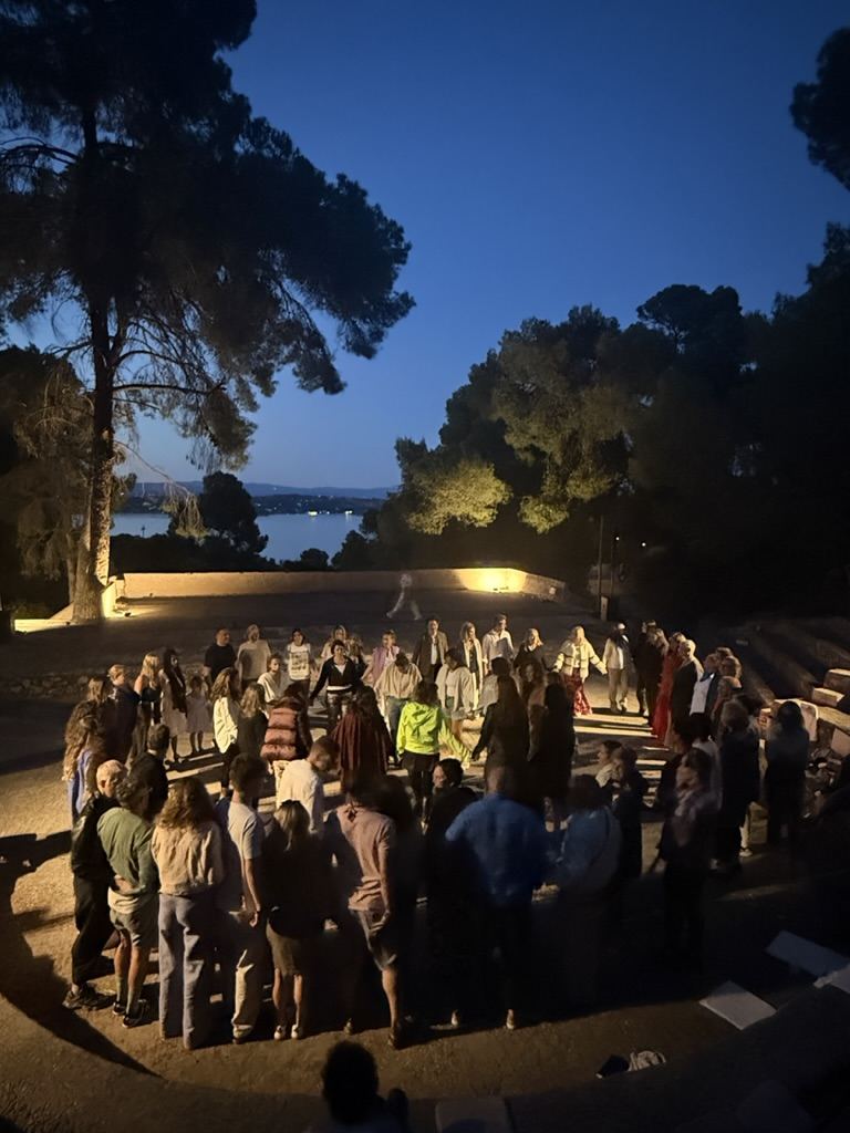 The circle gathered at blue hour