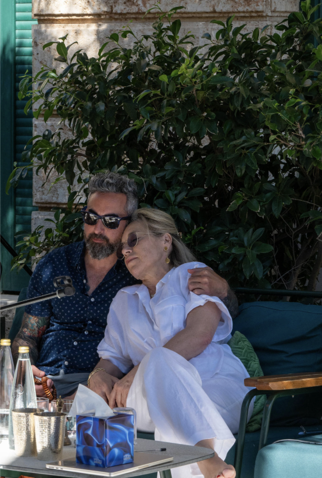 Two participants resting together in the afternoon shade