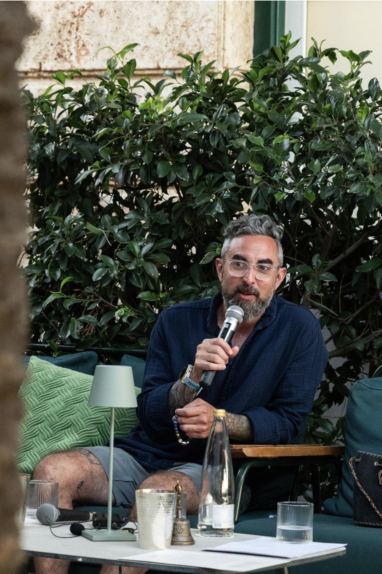 A participant speaking into the microphone
