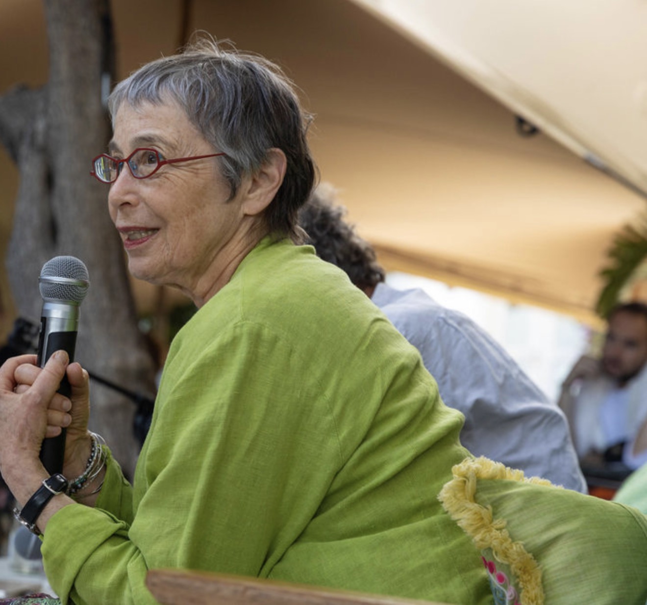 A voice in the circle — sharing under the tent