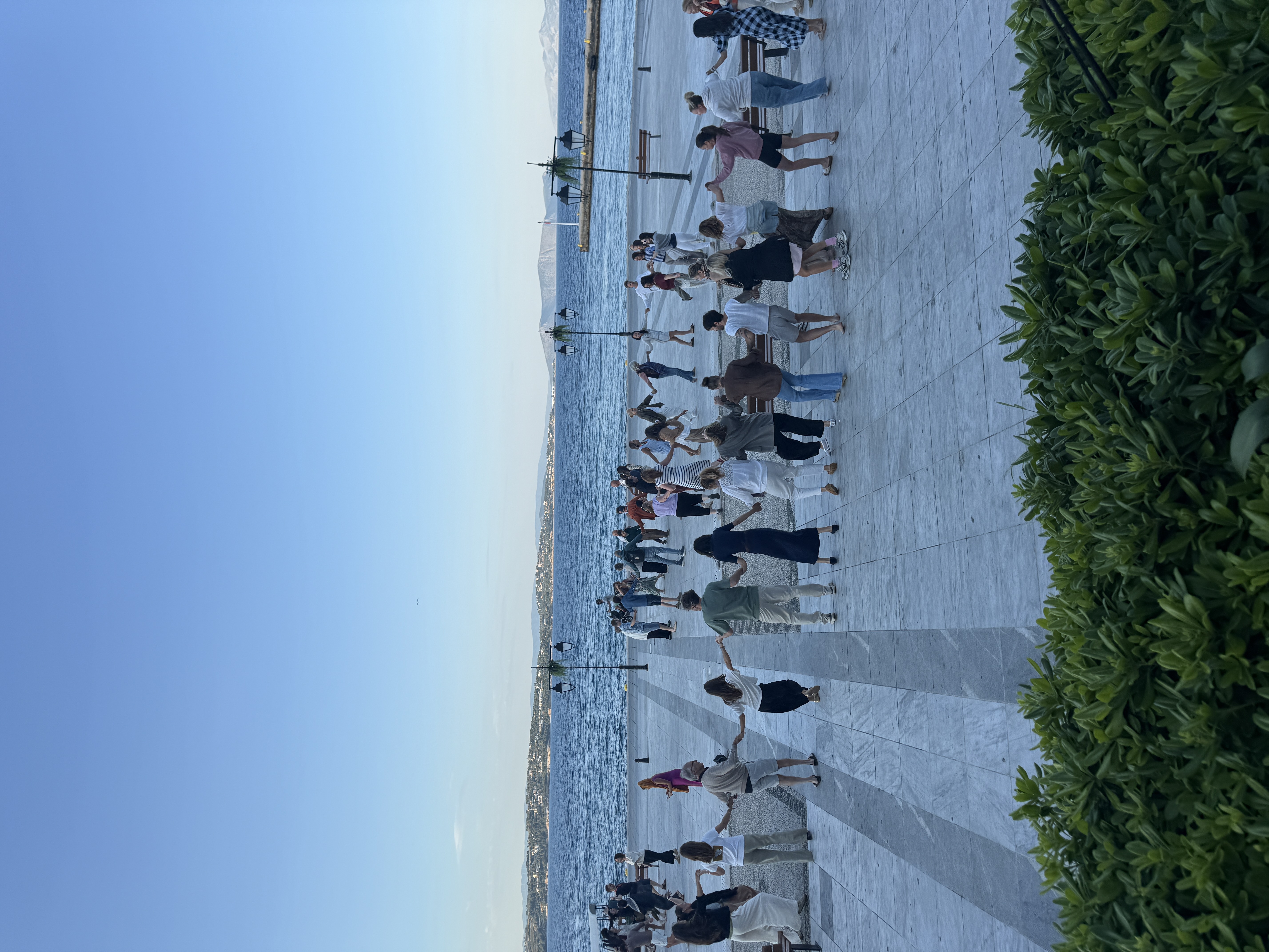 The full circle dancing by the sea at blue hour