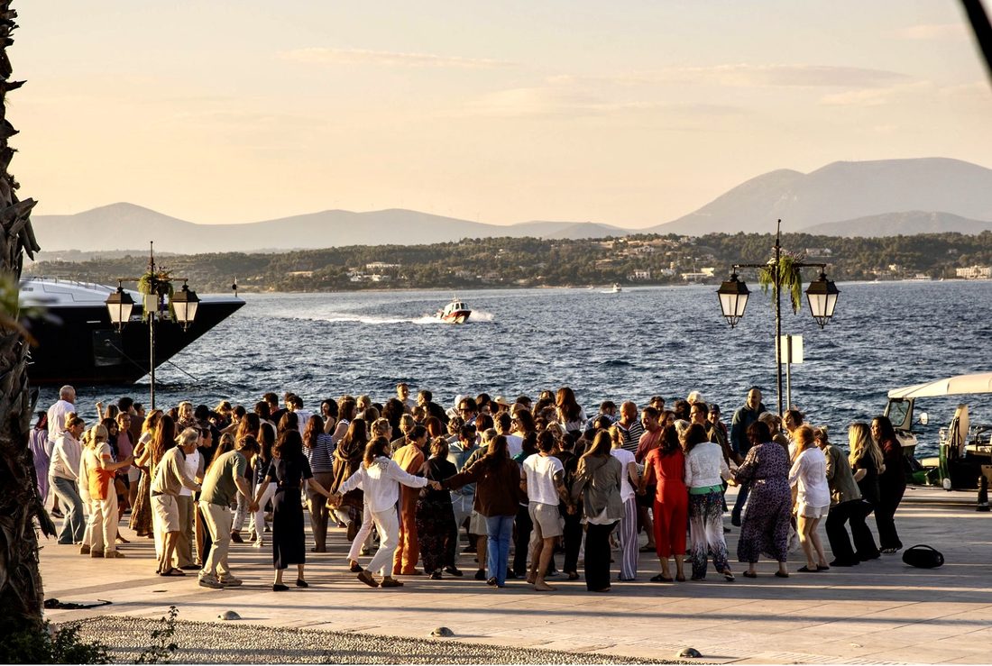The closing circle gathered by the sea at sunset, Spetses